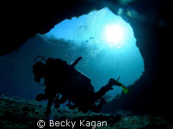 Alex swimming around in Jackson blue's  cave enterance in... by Becky Kagan 